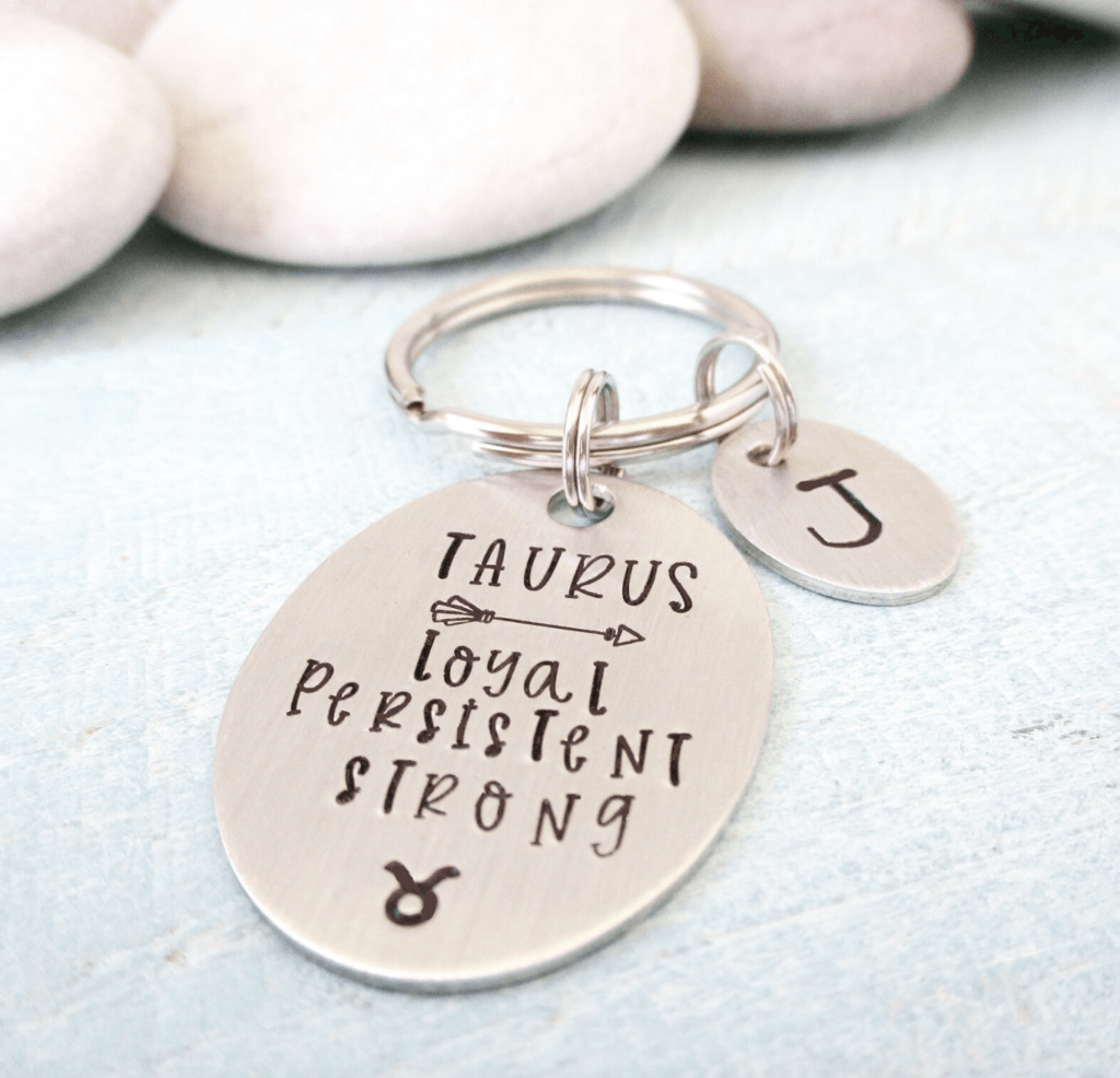 Taurus personalized silver keychain inscribed with key zodiac traits